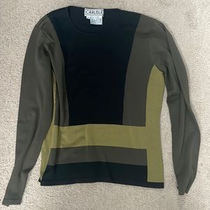 Classic Carlisle sweater 85% silk/15 % elastin.  Form fitting.